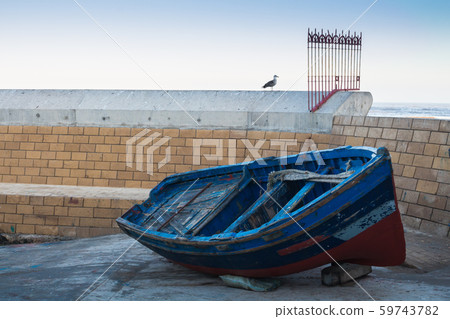 Fishing boat, fence and a seagull Fishing boat, fence and a seagull 59743782