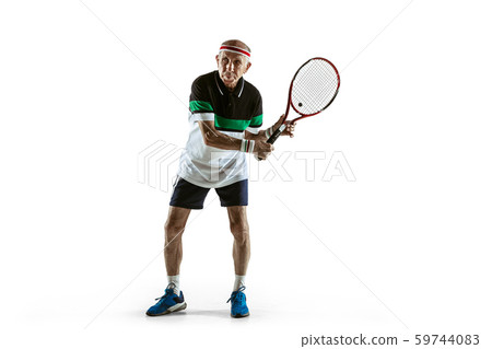 Senior man playing tennis in sportwear isolated on white background Senior man playing tennis in sportwear isolated on white background 59744083