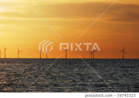 Windfarm on the sea at sunset Windfarm on the sea at sunset 59745323