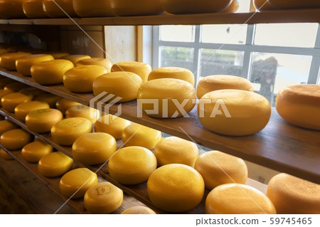 Lots of whole cheese in factory 59745465