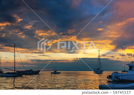 Sunset at boat marina with dramatic sky 59745537