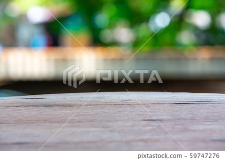 Empty curved wooden table texture, Green garden blurred bokeh background, Selective focus Empty curved wooden table texture, Green garden blurred bokeh background, Selective focus 59747276