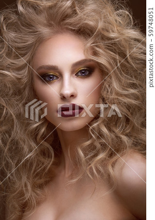 Beautiful blonde girl with curls, bright make-up . Beauty face. Beautiful blonde girl with curls, bright make-up . Beauty face. 59748051