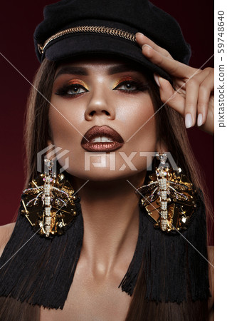 Beautiful brunette girl with curls, bright make-up and designer accessories. Beauty face. 59748640