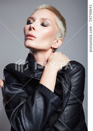 Fashionable beautiful woman with short hair Fashionable beautiful woman with short hair 59748641