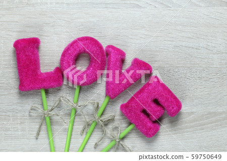 Pink Love letters on wooden floor. 59750649