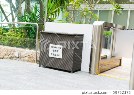 Used towel box on the rooftop pool of Marina Bay Sands Hotel Used towel box on the rooftop pool of Marina Bay Sands Hotel 59752375