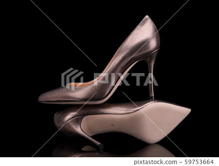 High-heeled shoes. Pumps on a black background. High-heeled shoes. Pumps on a black background. 59753664