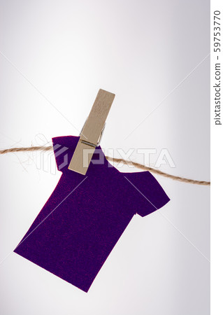 Paper clothes hang on a rope with clothespins Paper clothes hang on a rope with clothespins 59753770