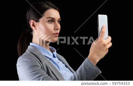 Business Lady Using Smartphone Identifying Person Standing On Black Background Business Lady Using Smartphone Identifying Person Standing On Black Background 59754333