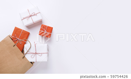 Shopping bag full of New Year present boxes on white Shopping bag full of New Year present boxes on white 59754426
