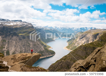 Sporty woman posing on Trolltunga Norway Sporty woman posing on Trolltunga Norway 59755998