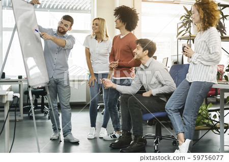 Young team planning new business strategy at work Young team planning new business strategy at work 59756077