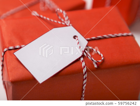 Close up of Christmas present box with white label 59756242
