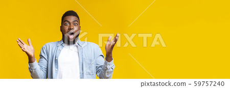 Shocked afro man raising hands and opening mouth in amazement Shocked afro man raising hands and opening mouth in amazement 59757240