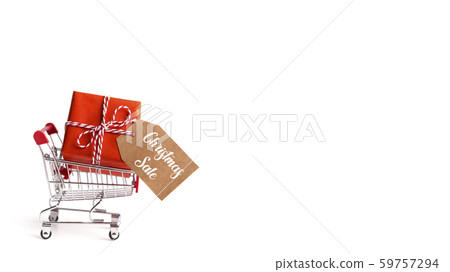 Wrapped gift box with tag inside shopping cart Wrapped gift box with tag inside shopping cart 59757294