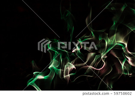 Green fire forms abstraction in black background Green fire forms abstraction in black background 59758602