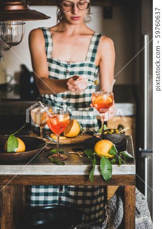 Young woman holding Aperol spritz cocktail and 59760637