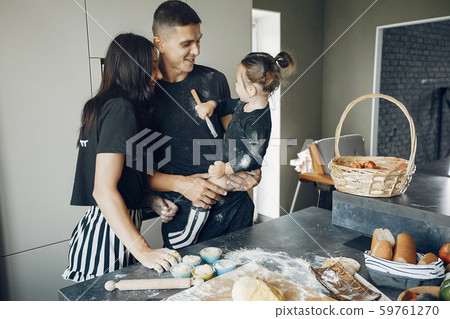 Family cook the dough for cookies at the kitchen Family cook the dough for cookies at the kitchen 59761270