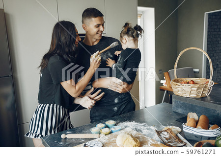 Family cook the dough for cookies at the kitchen Family cook the dough for cookies at the kitchen 59761271