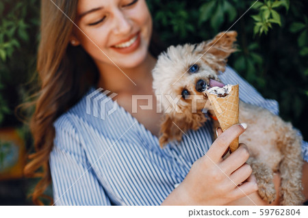 Elegant and stylish girl in a spring park Elegant and stylish girl in a spring park 59762804