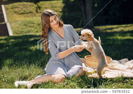 Elegant and stylish girl in a spring park Elegant and stylish girl in a spring park 59763832