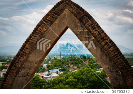 mountain view through gate of Poklongarai champa tower. Located in Phan Rang city 59765283