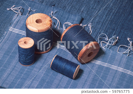 Indigo dyed yarn in reel and indigo dyed woven fabric 59765775