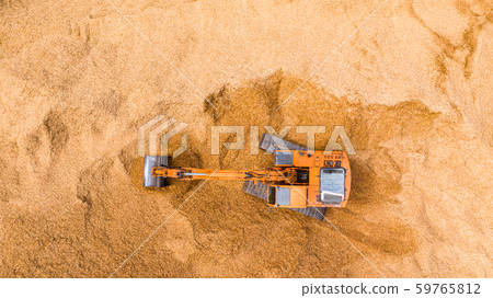 Aerial view excavator working on a construction Aerial view excavator working on a construction 59765812