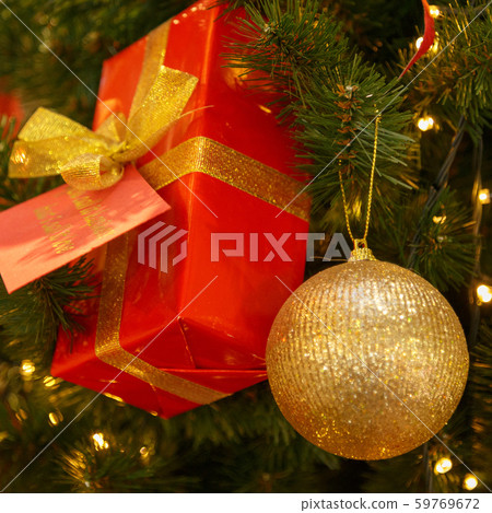 Christmas tree with silver bauble ornaments. Decorated Christmas tree closeup. Balls and illuminated Christmas tree with silver bauble ornaments. Decorated Christmas tree closeup. Balls and illuminated 59769672