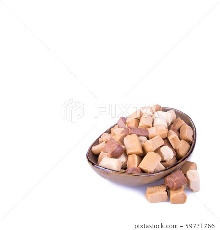 candies or caramel candies on a white background. candies or caramel candies on a white background. 59771766