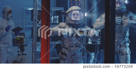 Astronauts and scientists testing spacesuit Astronauts and scientists testing spacesuit 59773209