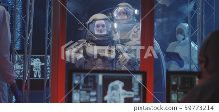 Astronauts and scientists testing spacesuit 59773214