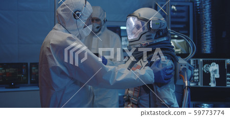 Astronaut and scientists testing spacesuit Astronaut and scientists testing spacesuit 59773774