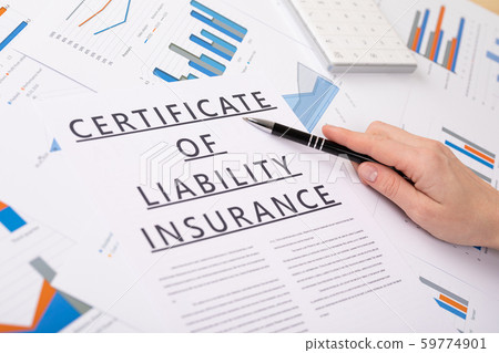 certificate of liability insurance concept, documents on the desktop certificate of liability insurance concept, documents on the desktop 59774901