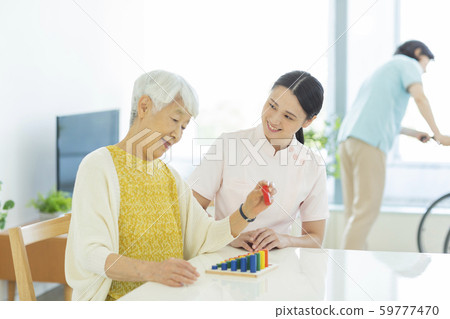 Senior woman rehabilitation 59777470