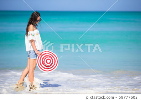 Young fashion woman in swimsuit on the beach Young fashion woman in swimsuit on the beach 59777602