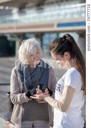 Homeless pensioner feeling good while speaking with volunteer Homeless pensioner feeling good while speaking with volunteer 59777718