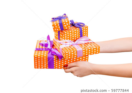 Woman hands give wrapped set of Christmas or other Woman hands give wrapped set of Christmas or other 59777844