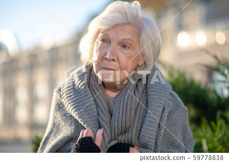 Close up of aged homeless woman wearing sweater Close up of aged homeless woman wearing sweater 59778838