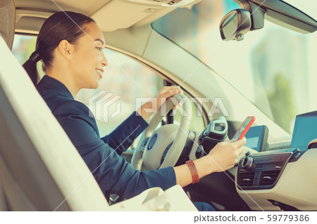 Positive delighted Asian female person reading message Positive delighted Asian female person reading message 59779386