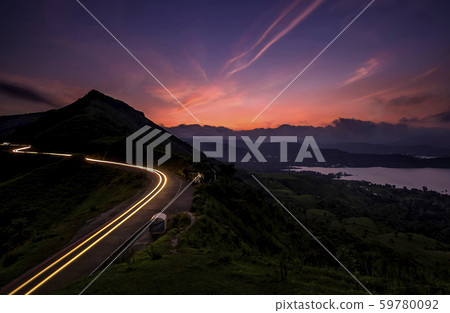 Light trails at Sajjangarh fort at dusk, Satara, Maharashtra, India 59780092