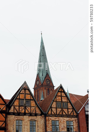 Old houses and tower of the Cathedral of Schwerin in Germany Old houses and tower of the Cathedral of Schwerin in Germany 59780233