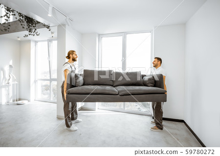 Movers placing couch at home 59780272