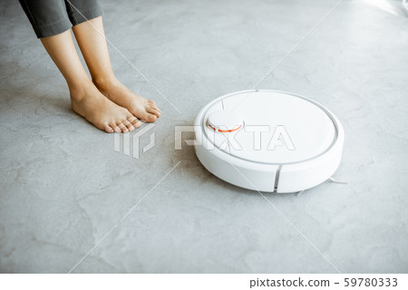 Automatic vacuum cleaner working on the floor Automatic vacuum cleaner working on the floor 59780333