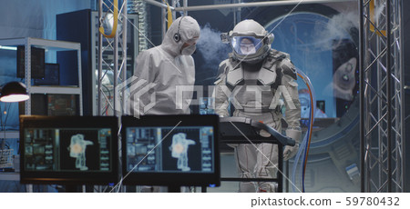 Astronaut walking on a treadmill 59780432