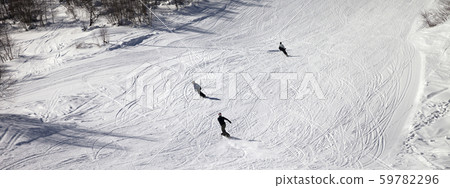 Skiers and snowboarders on ski slope at sun winter Skiers and snowboarders on ski slope at sun winter 59782296