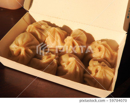 High angle view of  Xiao Long Bao also called  steamed soup dumplings in paper lunch box. Taiwan food concept. 59784070