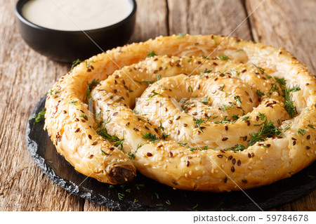 Homemade borek (burek) pie with feta cheese Homemade borek (burek) pie with feta cheese 59784678