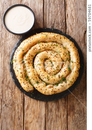 Tasty turkish borek pie (burek) with feta closeup. 59784681